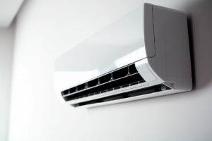 white air conditioner mounted on a white wall
