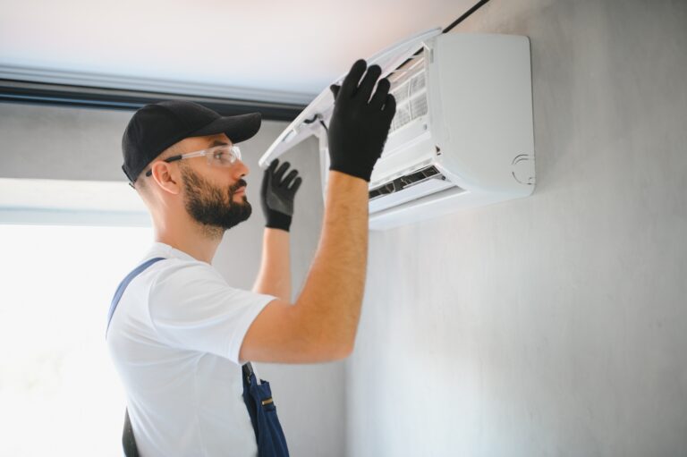 Repairman fix air conditioning systems