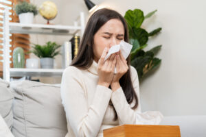 woman sneezing